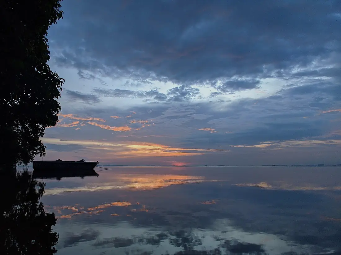 Mirror-like water during Lake Nabugabo sunrise